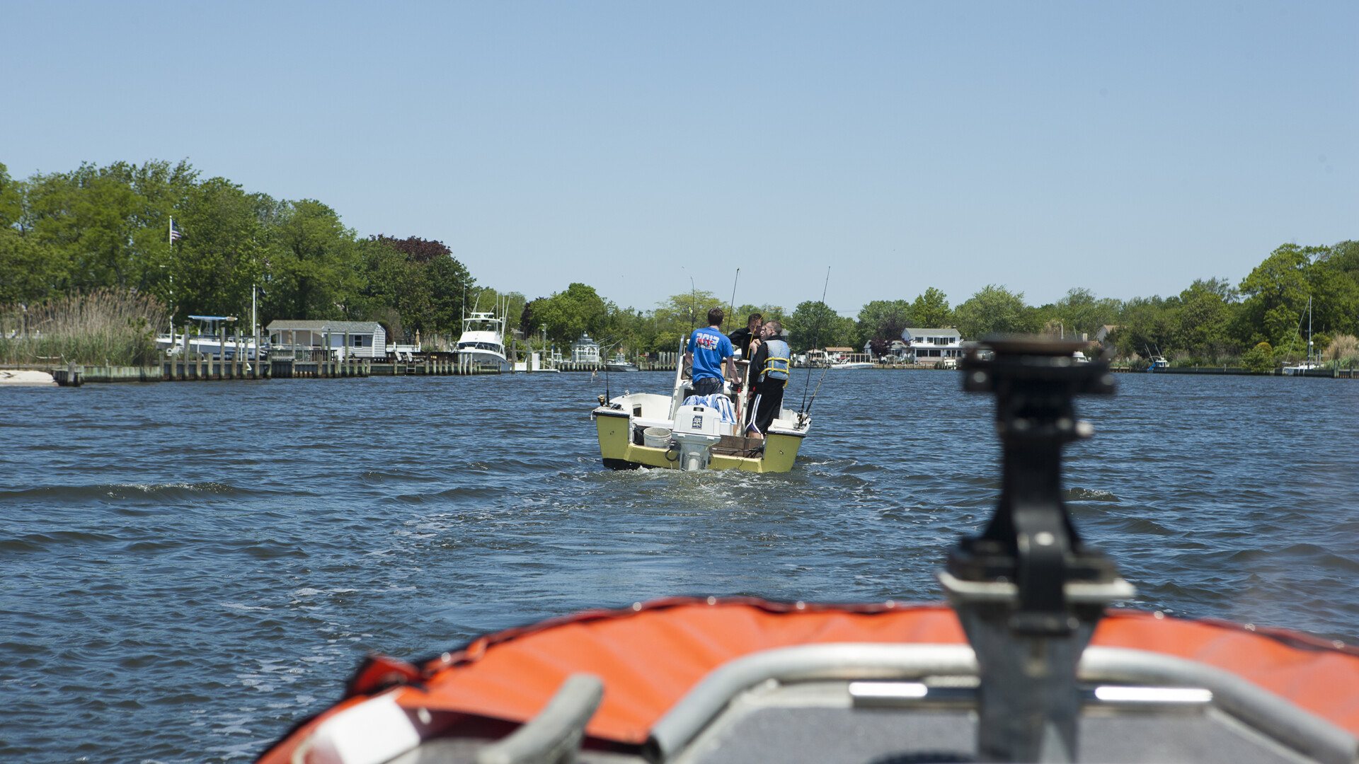 Coast Guard boat crew from Station Fire Island escorting a recreational boat back to the pier near Fire Island, New York