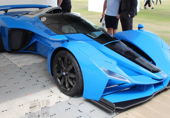 Blue Delage D12 hypercar, the modern revival of the French marque, on display at a car show
