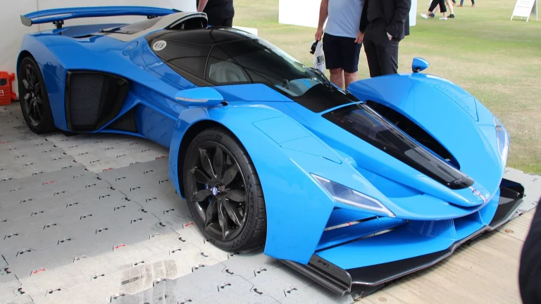 Blue Delage D12 hypercar, the modern revival of the French marque, on display at a car show