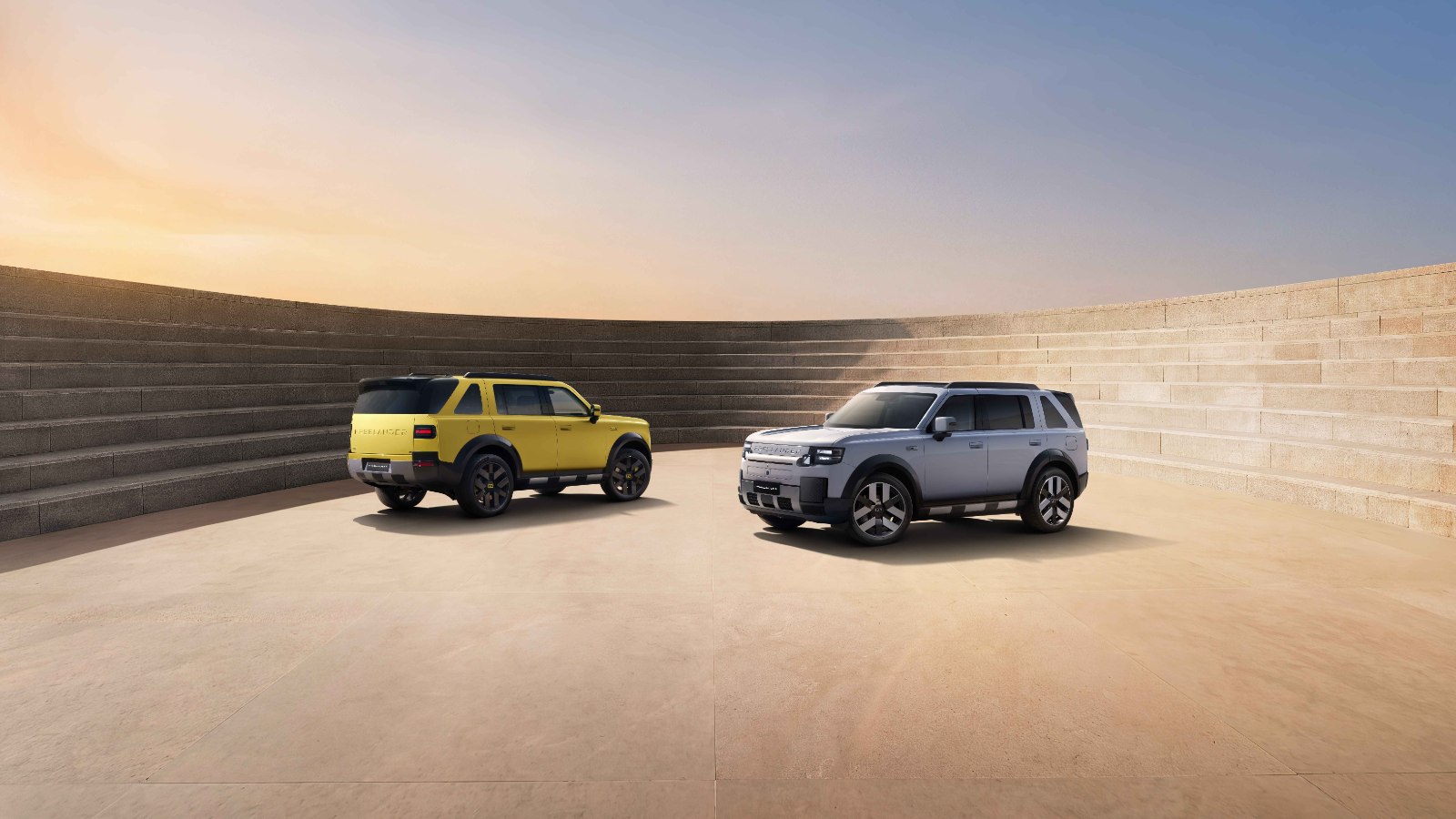 FREELANDER 8 SUVs in yellow and silver on the launch stage backdrop ahead of the brand's Abu Dhabi debut