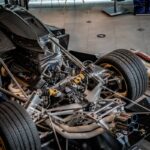 Bare race car chassis under construction in a race shop, similar to the build stages for a Gen3 Supercars tub