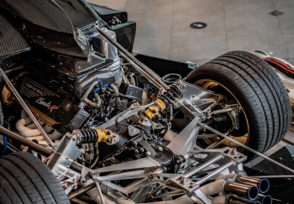 Bare race car chassis under construction in a race shop, similar to the build stages for a Gen3 Supercars tub