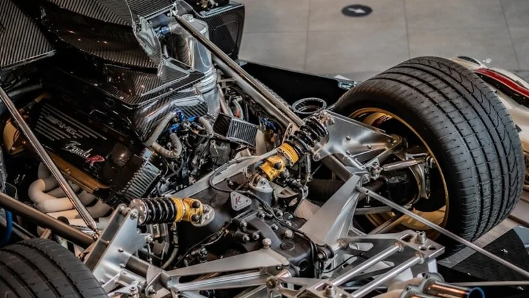 Bare race car chassis under construction in a race shop, similar to the build stages for a Gen3 Supercars tub