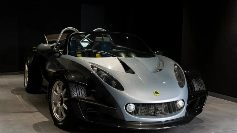 a silver and black sports car on display at a car show
