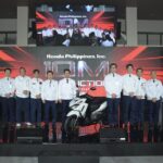 Honda Philippines executives and staff pose with the 10-millionth motorcycle, a Click125 Smart Edition, at the Batangas production ceremony