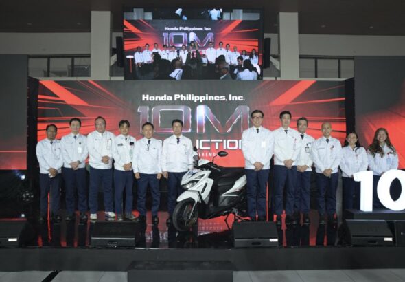 Honda Philippines executives and staff pose with the 10-millionth motorcycle, a Click125 Smart Edition, at the Batangas production ceremony