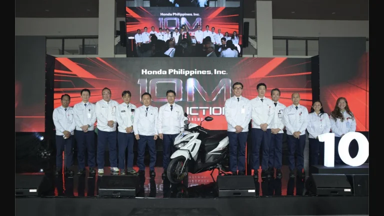 Honda Philippines executives and staff pose with the 10-millionth motorcycle, a Click125 Smart Edition, at the Batangas production ceremony