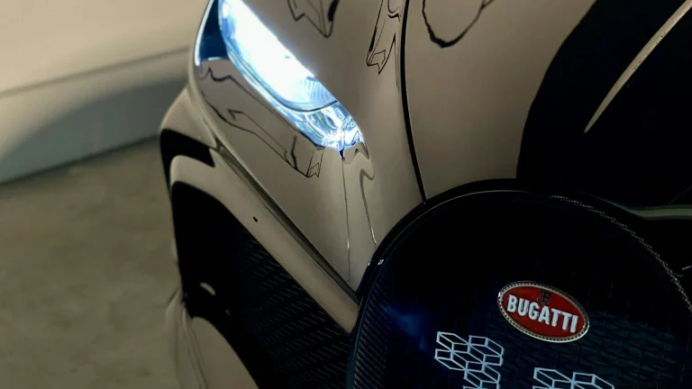 black and silver car with black and blue round cover