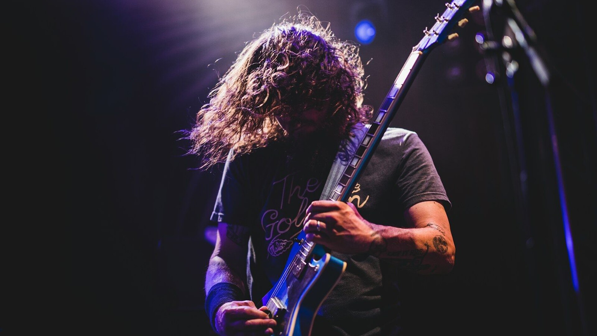 man playing electric guitar