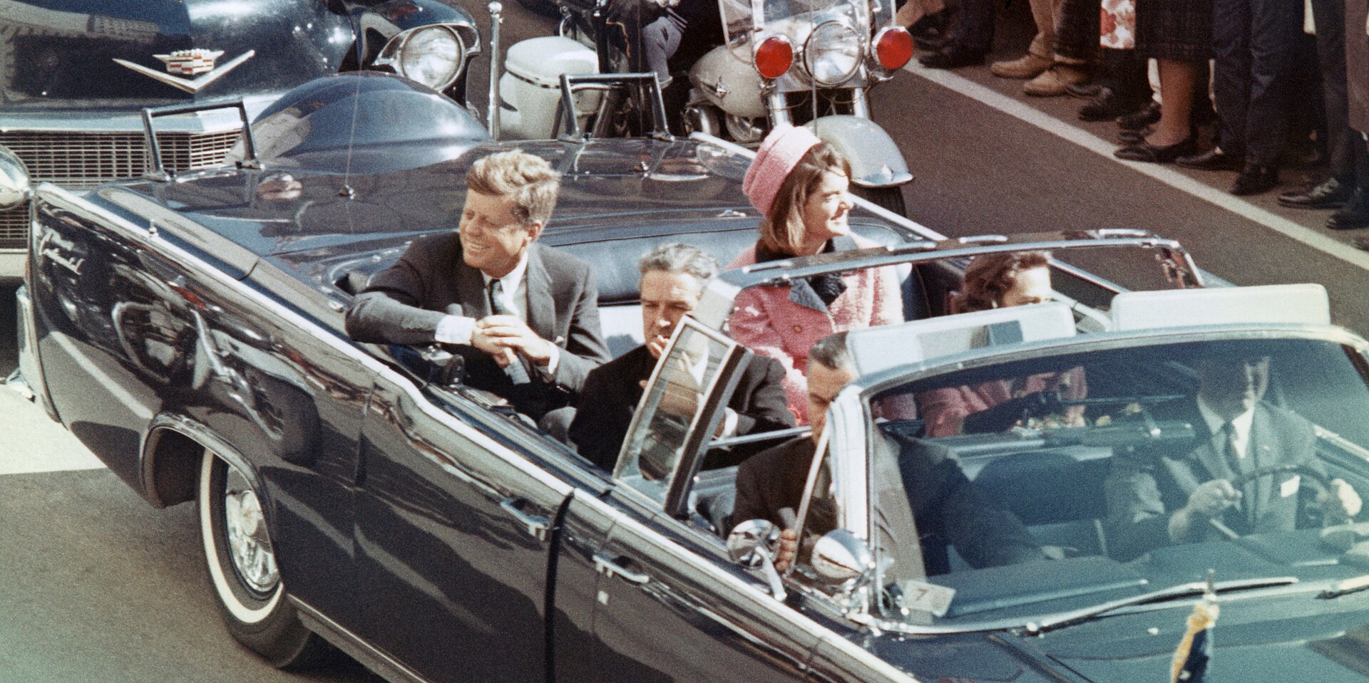 President Kennedy riding in SS-100-X in the Dallas motorcade, November 22, 1963