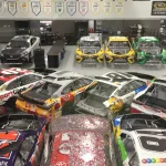 Rows of Joe Gibbs Racing Cup Series cars on the team's shop floor in Huntersville, North Carolina