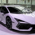A stock Lamborghini Revuelto in pale lilac paint shown from the front three-quarter angle