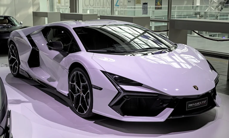 A stock Lamborghini Revuelto in pale lilac paint shown from the front three-quarter angle