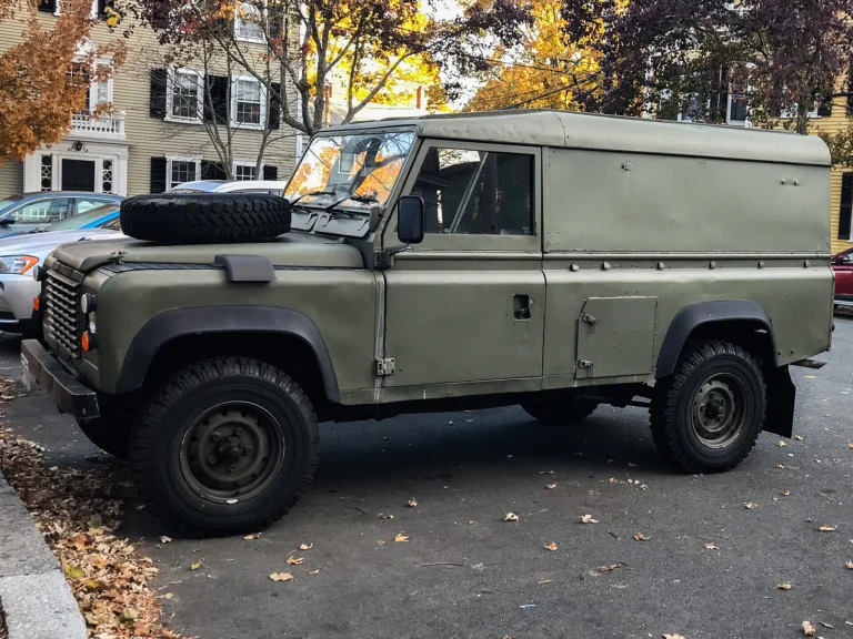 Classic Land Rover Defender 110 hardtop parked on a US city street
