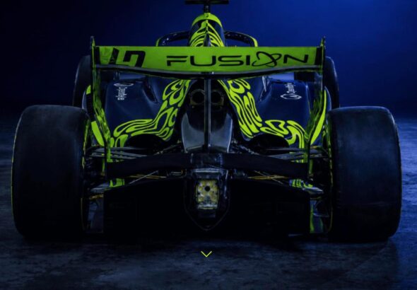 LN4 Fusion race car in the team's dark navy and neon green livery, rear three-quarter studio shot