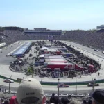 Cars racing at Martinsville Speedway with the grandstands full