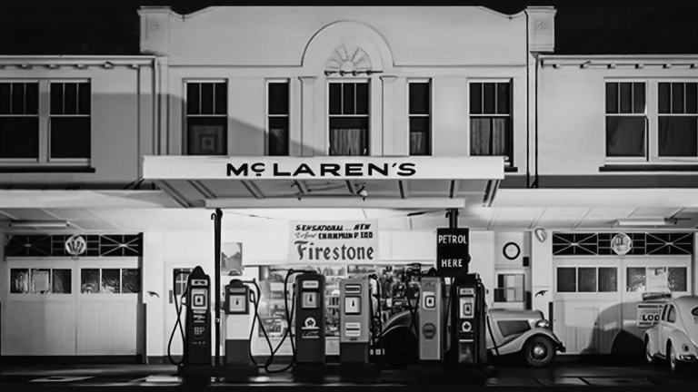 Black and white archival photo of the McLaren's sign above Bruce McLaren's parents' service station in Remuera, Auckland, the inspiration for McLaren's new wordmark