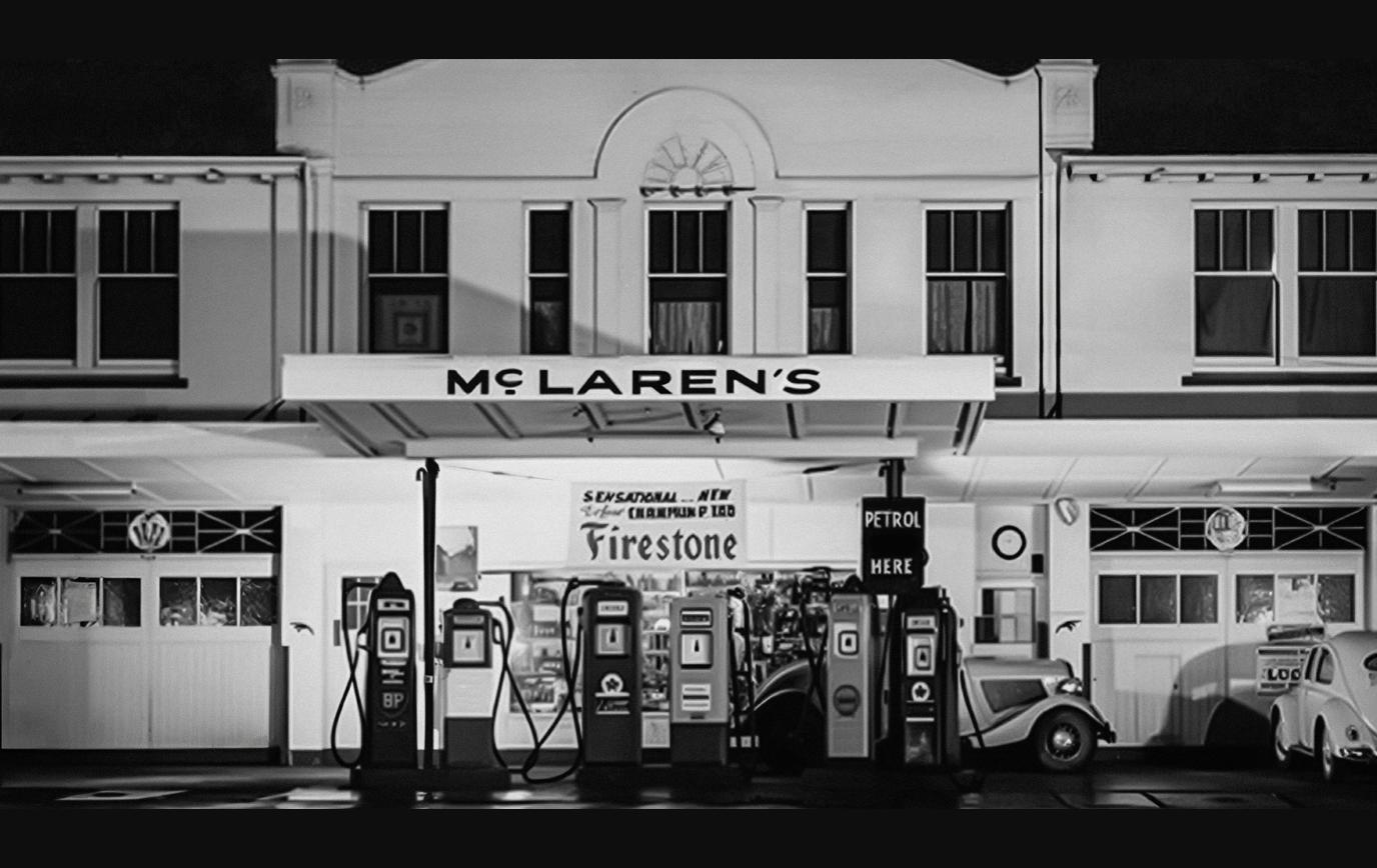 Black and white archival photo of the McLaren's sign above Bruce McLaren's parents' service station in Remuera, Auckland, the inspiration for McLaren's new wordmark