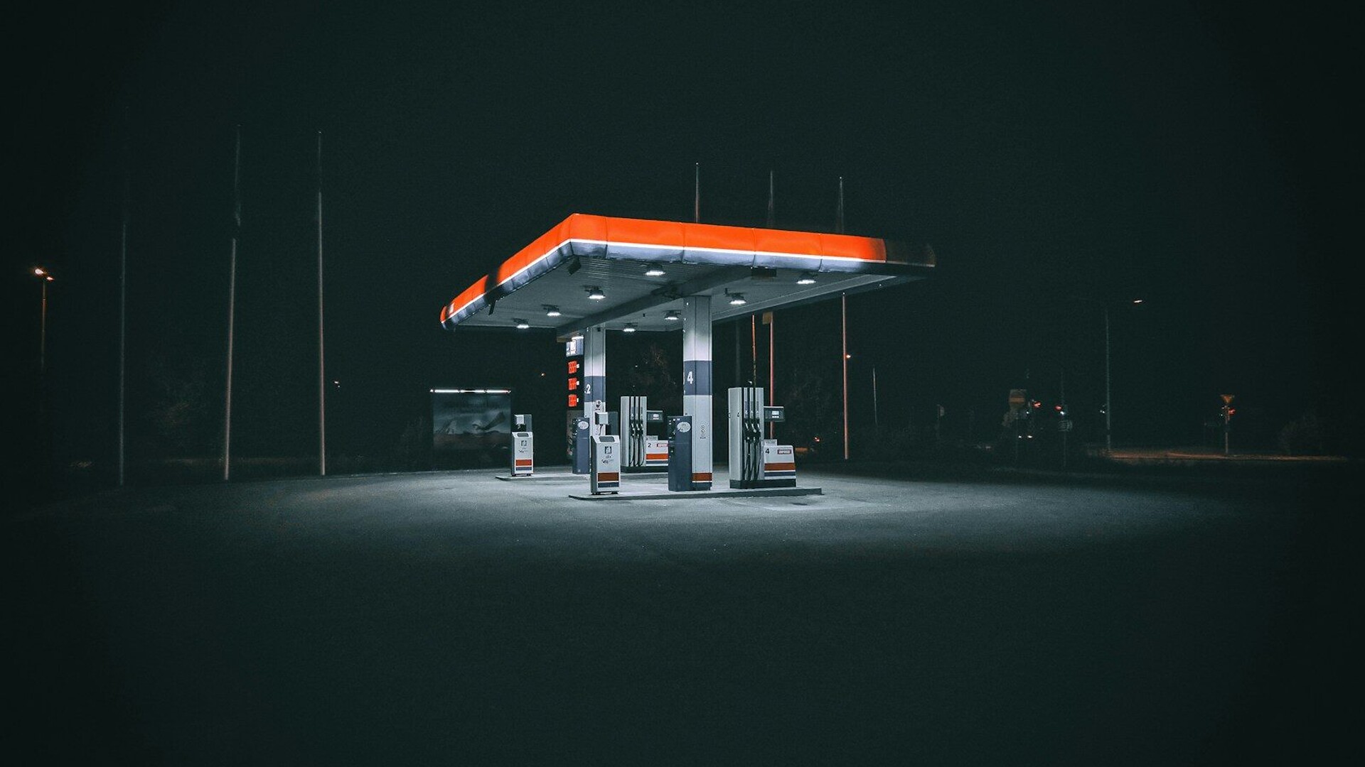 a gas station at night with no people around