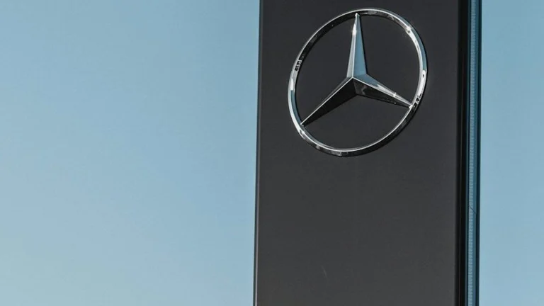 Mercedes-Benz signage under clear blue sky