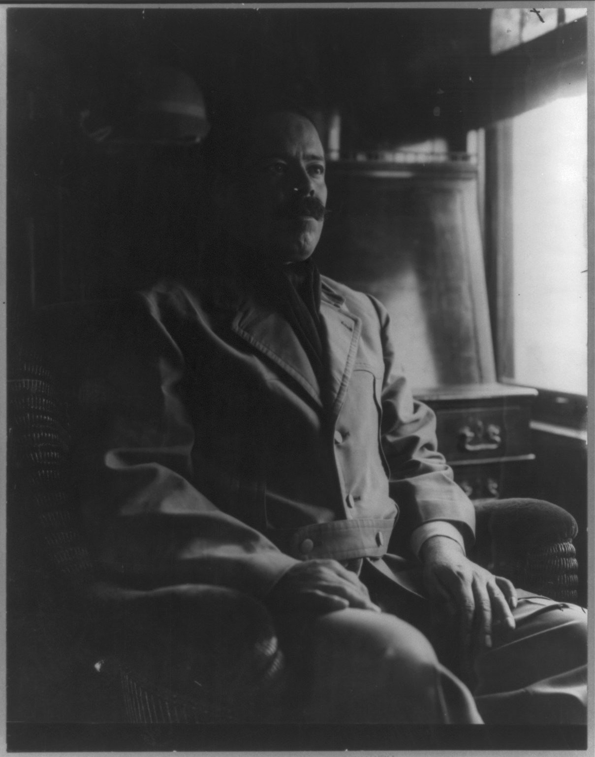 General Francisco "Pancho" Villa seated in a railroad car during the Mexican Revolution