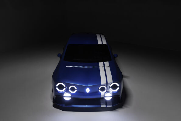 Renault 8 Gordini Concept front view at night with six illuminated round headlights and double white stripe