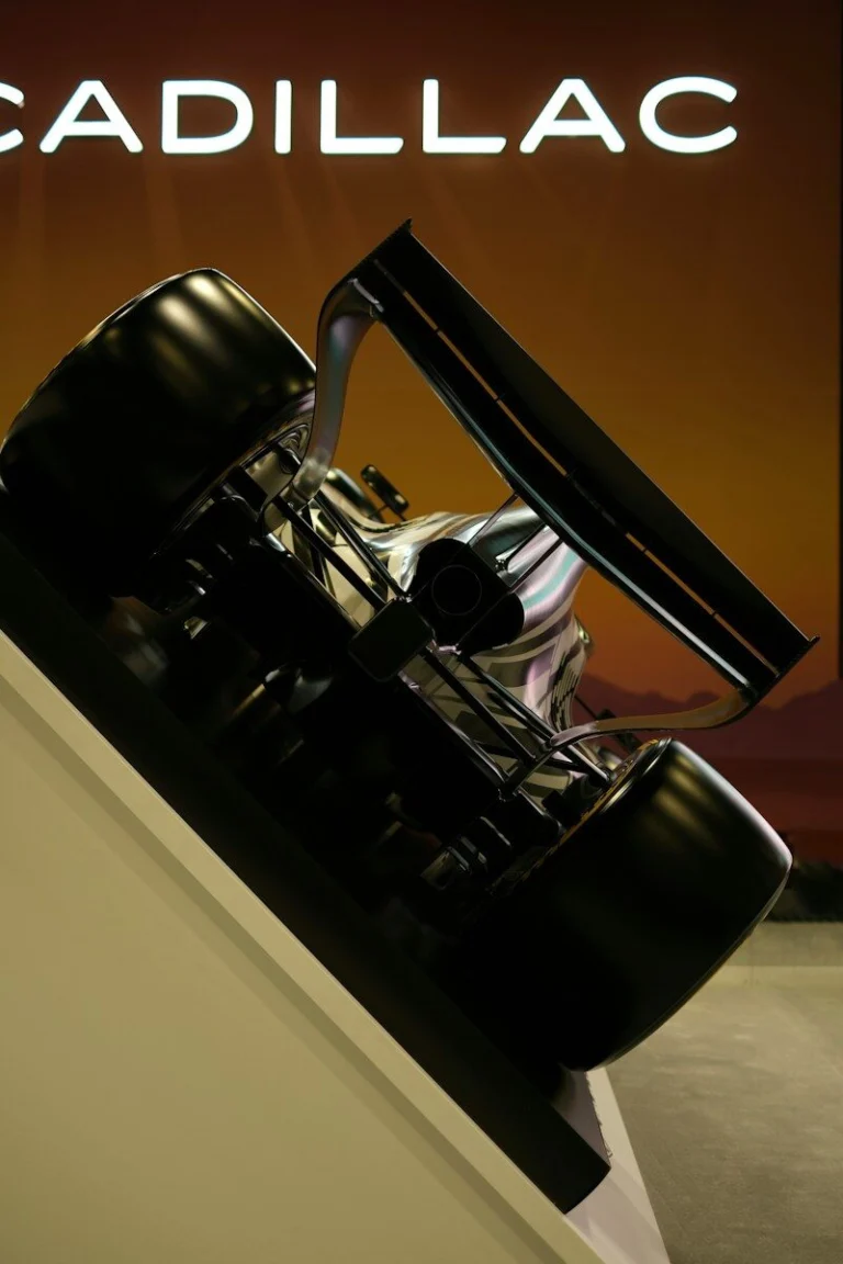 Cadillac logo above a sleek, modern car design