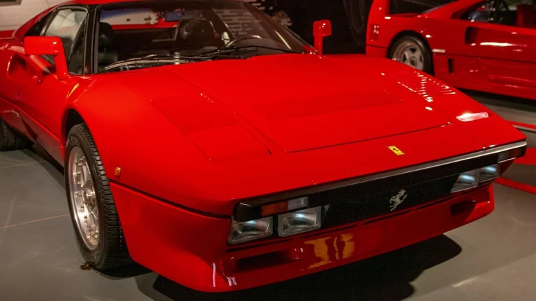 a red sports car parked in a garage