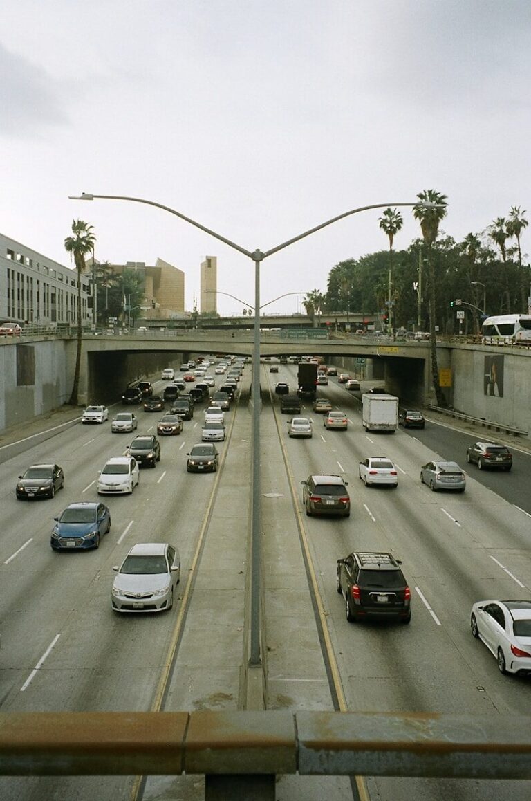 Traffic backed up on a Los Angeles freeway under a hazy, smog-filled sky