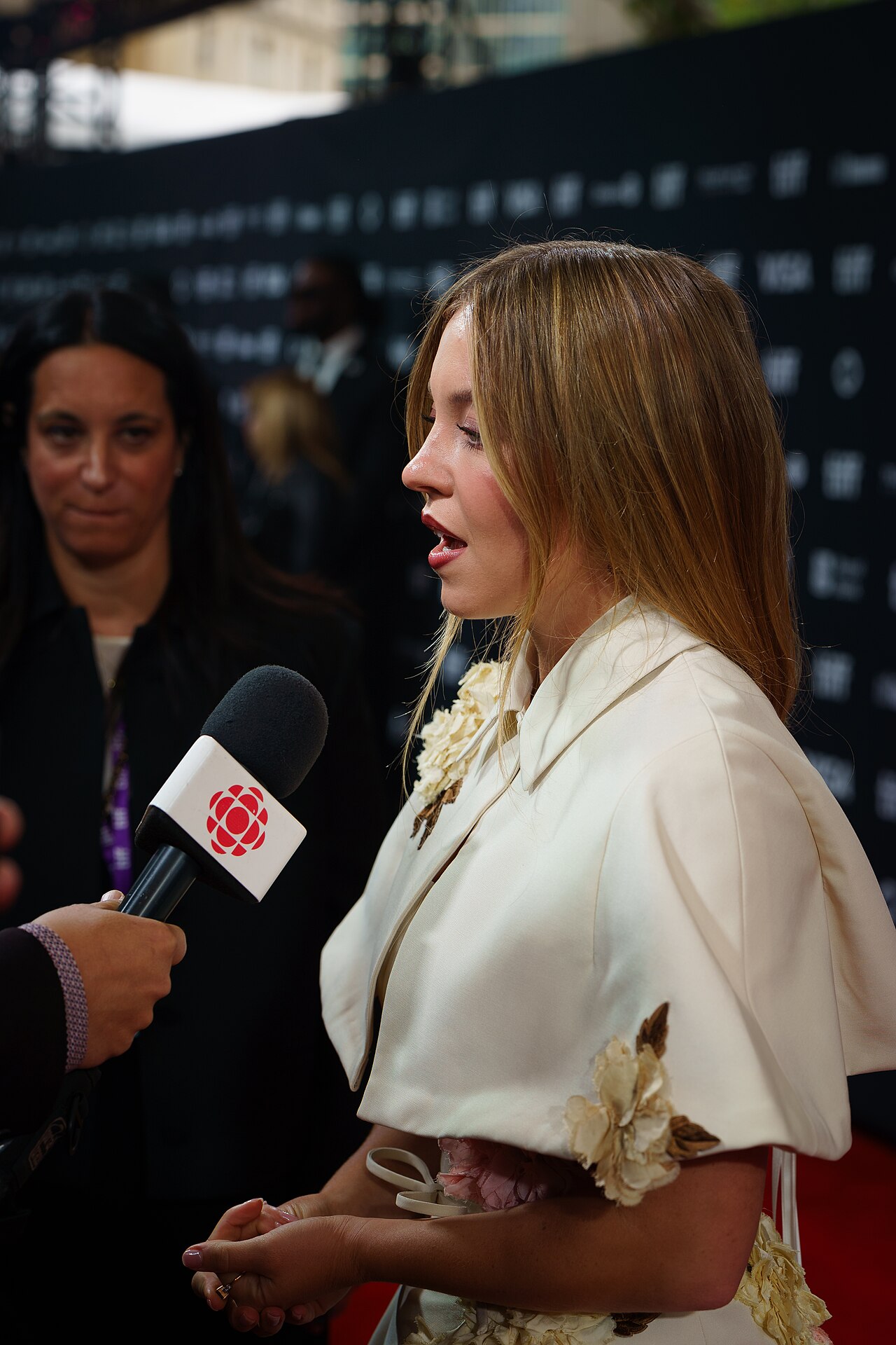 Sydney Sweeney speaking to a reporter at the Toronto International Film Festival