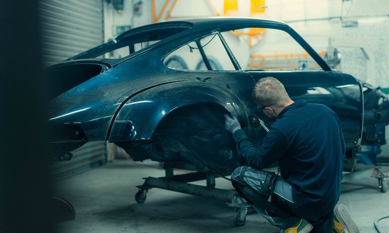 A TECHART technician working on a 964 body shell for the GTclassic