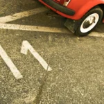 red car on black asphalt road