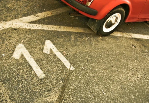 red car on black asphalt road