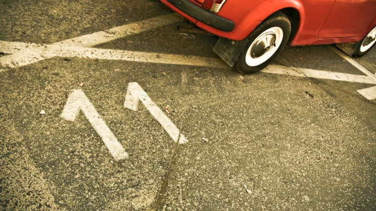 red car on black asphalt road