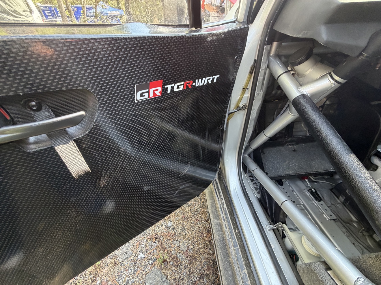 Gravel-spec rally wheels and suspension covered in Tennessee dirt