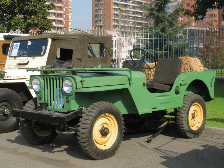 Green 1946 Willys CJ-2A with yellow wheels, the civilian Jeep that inspired the 2027 Wrangler JL-2A