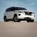 2027 Nissan Patrol Y63 white SUV front three-quarter in desert