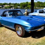 Blue 1967 Chevrolet Corvette Sting Ray convertible at a waterfront car show