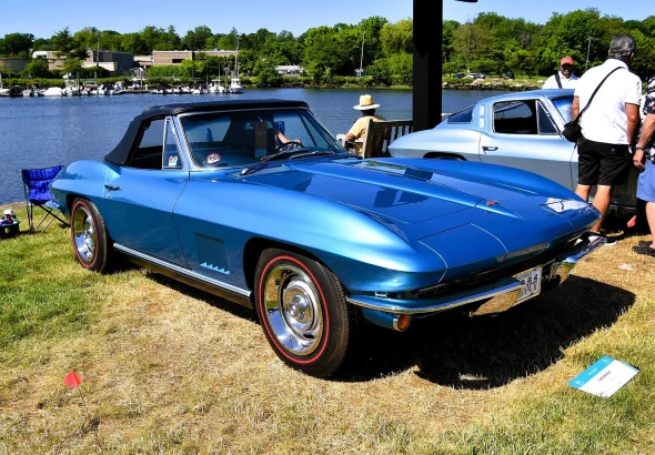 Blue 1967 Chevrolet Corvette Sting Ray convertible at a waterfront car show