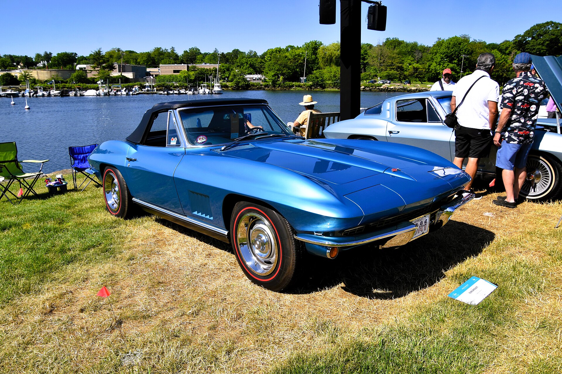 Blue 1967 Chevrolet Corvette Sting Ray convertible at a waterfront car show