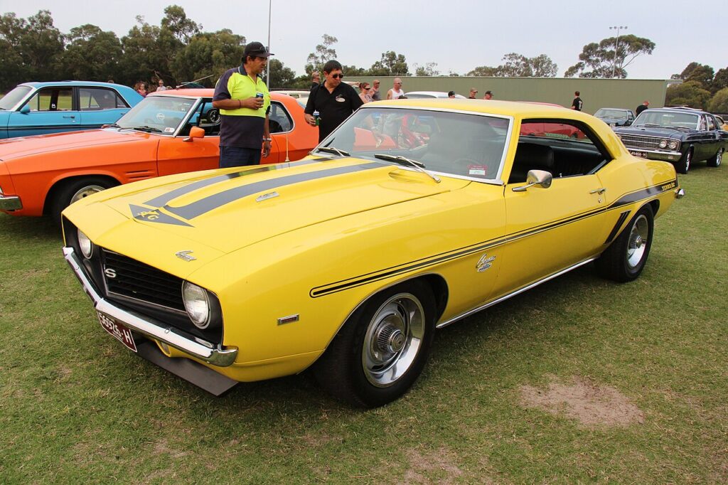Daytona Yellow 1969 Chevrolet Camaro with Yenko 427 badging at a car show
