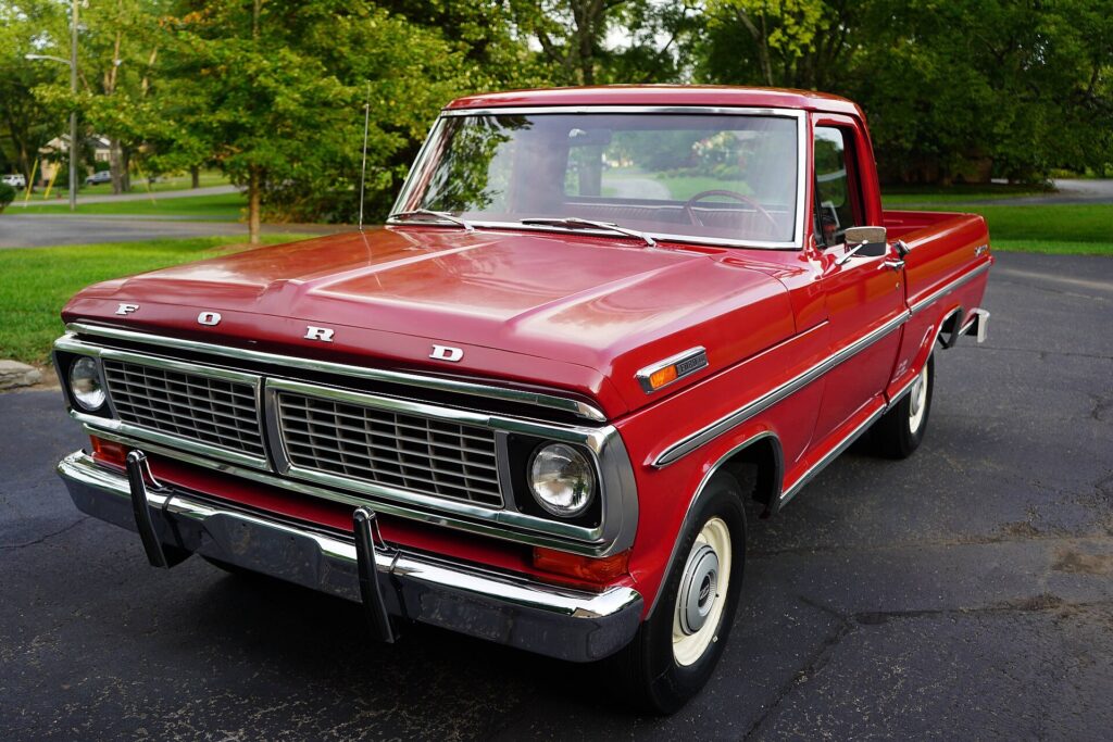 A red 1970 Ford F-100 pickup truck
