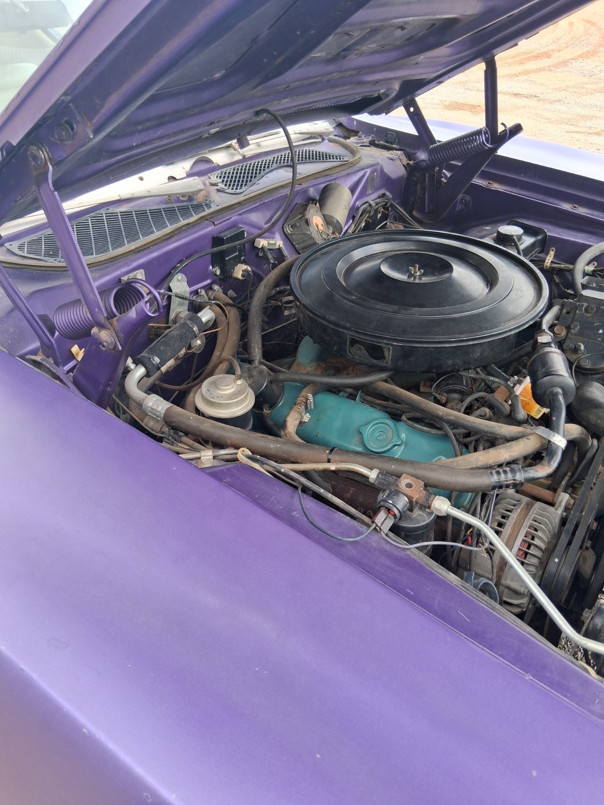 383 V8 engine bay of a purple 1971 Dodge Charger