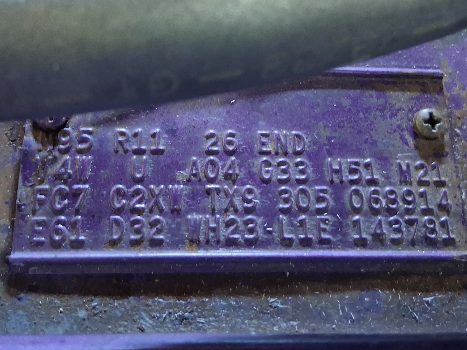 Stamped fender tag on a 1971 Dodge Charger showing paint and trim codes