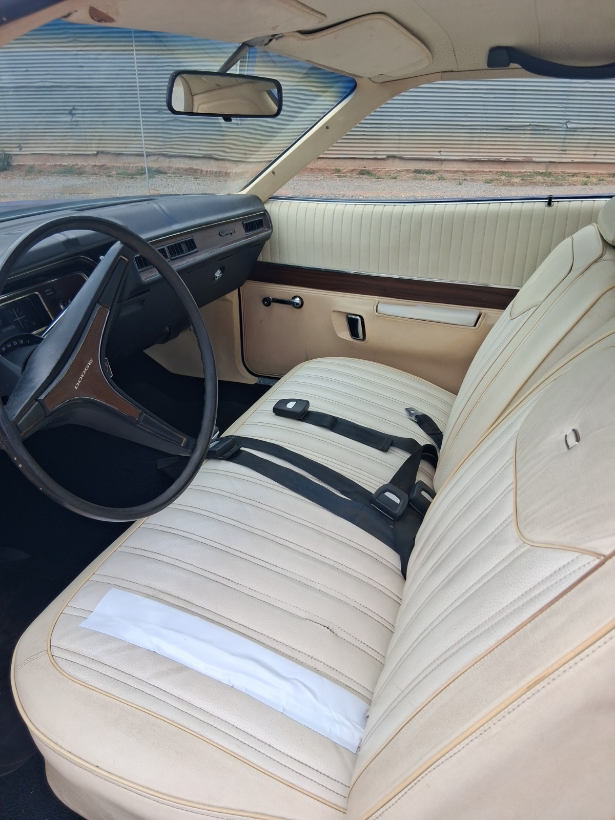 White vinyl bench seat and dash in a 1971 Dodge Charger