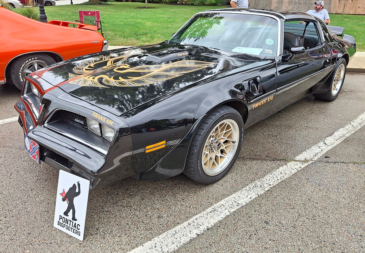 Black and gold 1977 Pontiac Trans Am at a car show