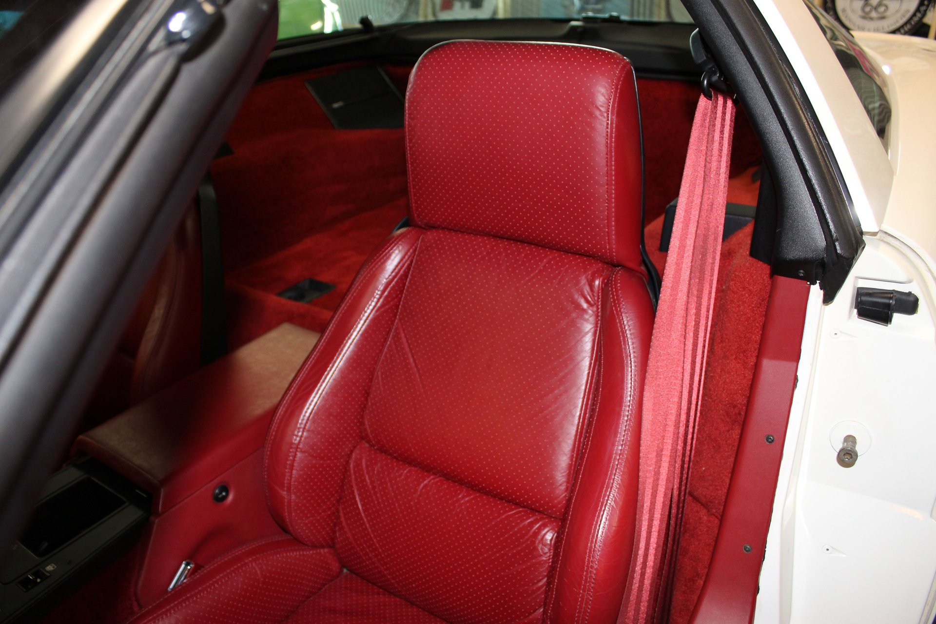 Red leather driver seat in the 1984 Corvette