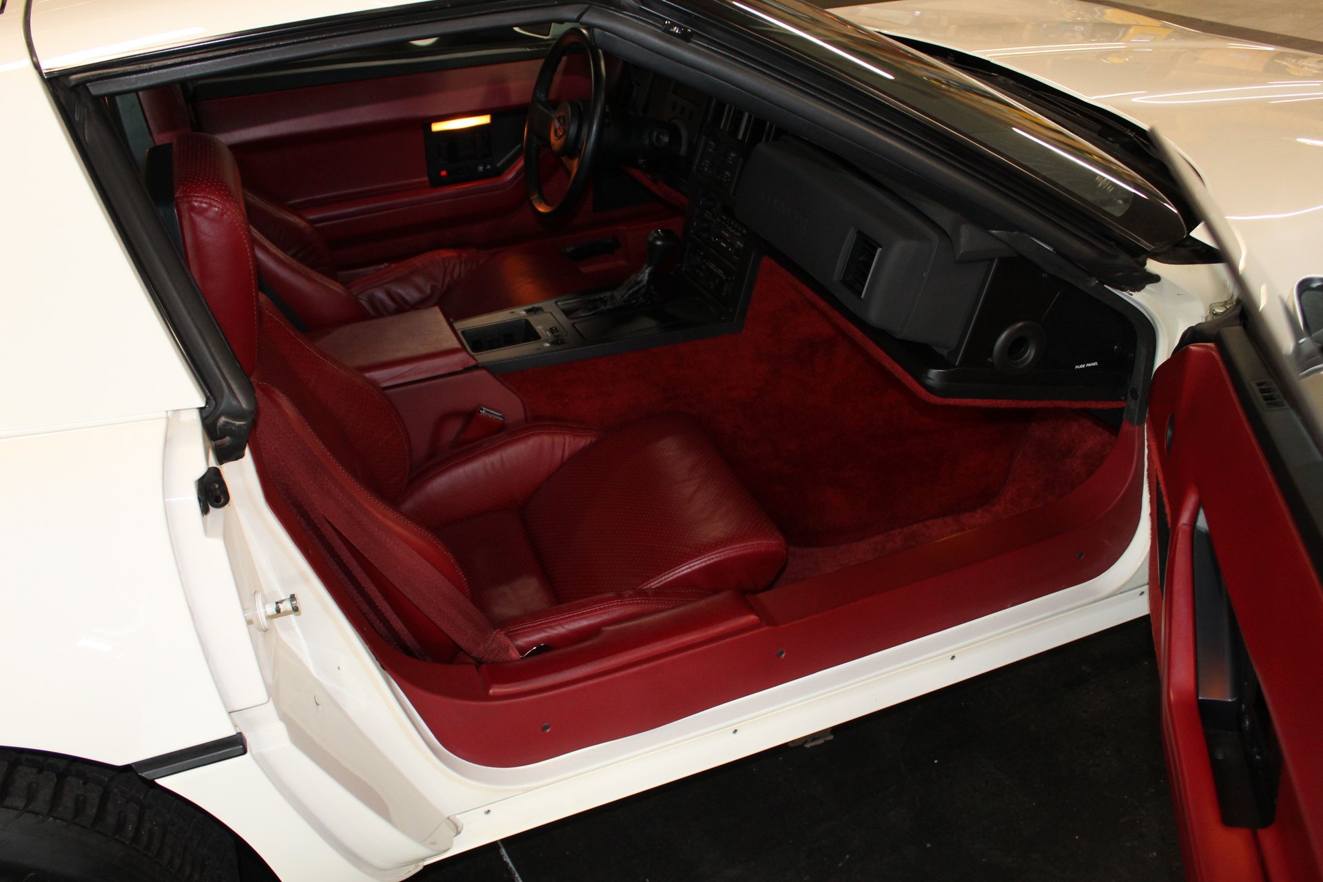 Passenger side view of the red interior in the 1984 Corvette