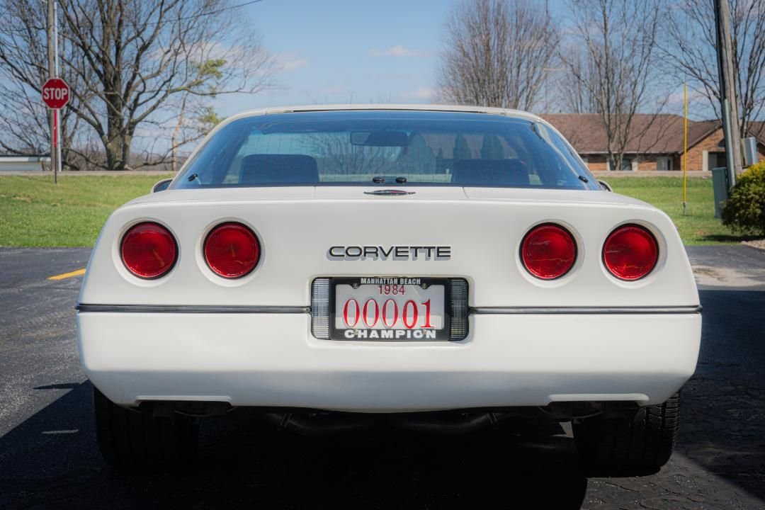 Rear of the white 1984 Corvette showing quad taillights