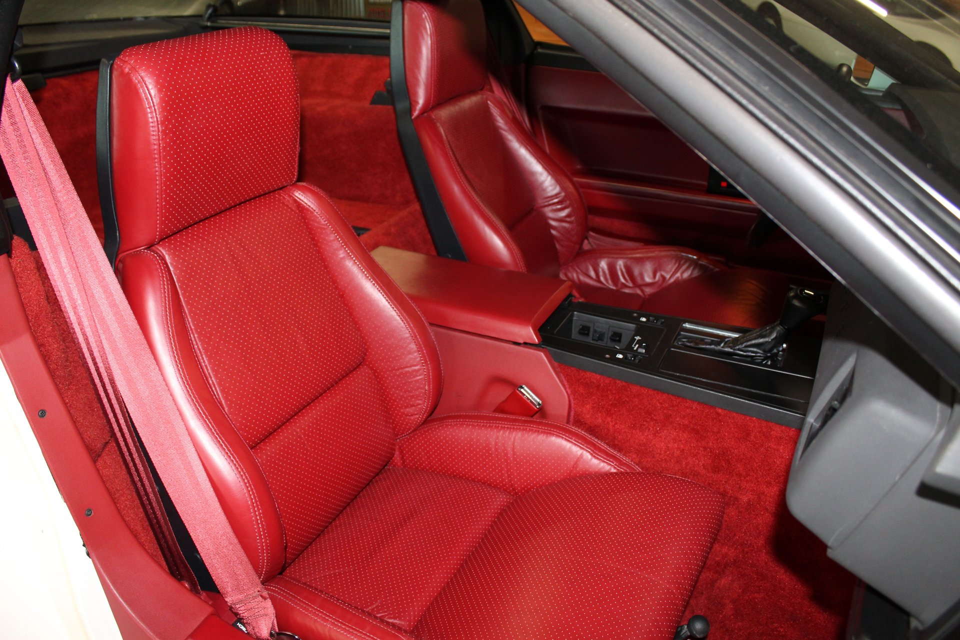 Red bucket seats and console of the 1984 Corvette